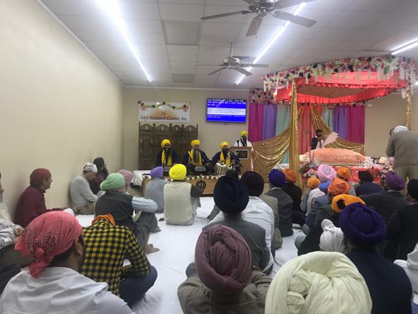 A continuous stream of the faithful who came throughout the day and night for the commemoration of the 351st birthday of the tenth Guru Gobind Singh at the Sikh National Center