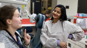 Neeharika Bhashyam, right, a U School of Dentistry student from India, talked with Dasha Grishina, a third year dental student, following class Thursday. Bhashyam worries the Trump administration will reverse an Obama rule change that granted her and other spouses of high-skilled foreign workers permission to work. (Anthony Souffle / Minneapolis Star Tribune)