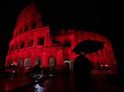 A view of the Colosseum lit up in red to draw attention to the persecution of Christians around the world. (AP)