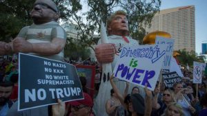  Large inflated figures of Sheriff Joe Arpaio (L) and President Trump are seen above ant-Trump protesters outside the Phoenix Convention Center at a rally by President Donald Trump on August 22, 2017 in Phoenix, Arizona