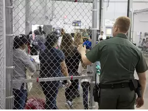 A view of inside US Customs and Border Protection (CBP) detention facility shows detainees inside fenced areas at Rio Grande Valley Centralized Processing Center in Rio Grande City, Texas, US. 