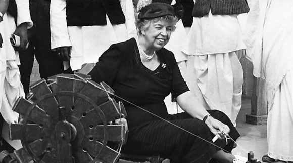 Former First Lady Eleanor Roosevelt at a spinning wheel in Delhi.