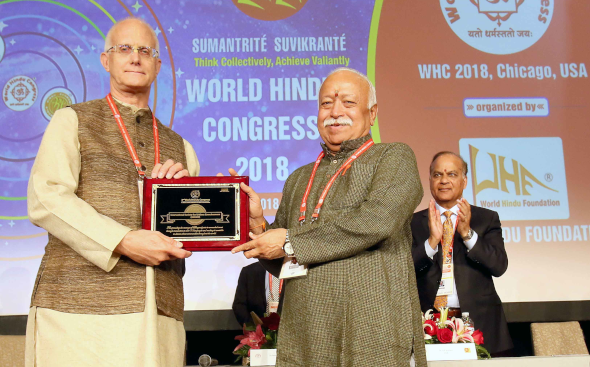 Anuttama Das of ISKCON receiving the award from Dr. Mohan Bhagwat
